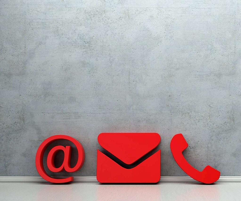 Icons for letter, email and phone in red against gray background