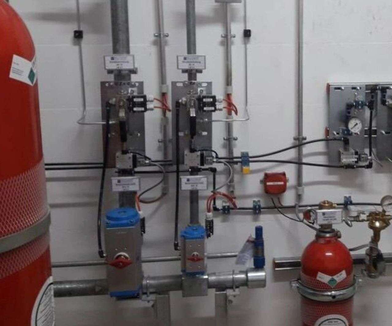 Red gas cylinders and supply lines